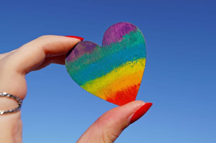 Holding rainbow heart