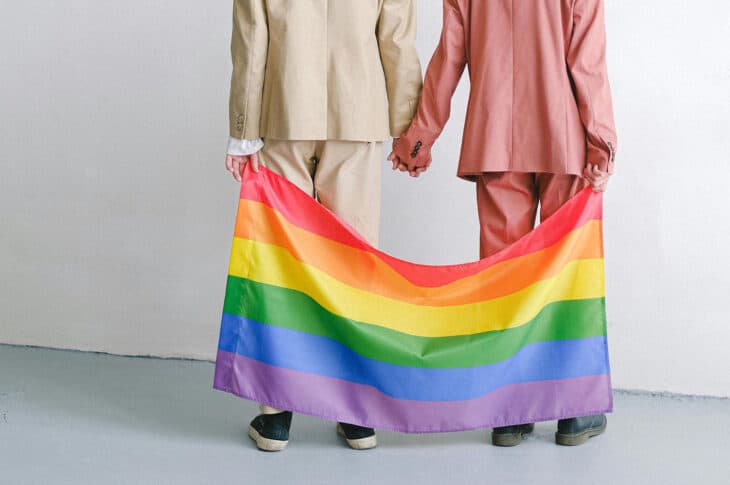 Holding rainbow flag